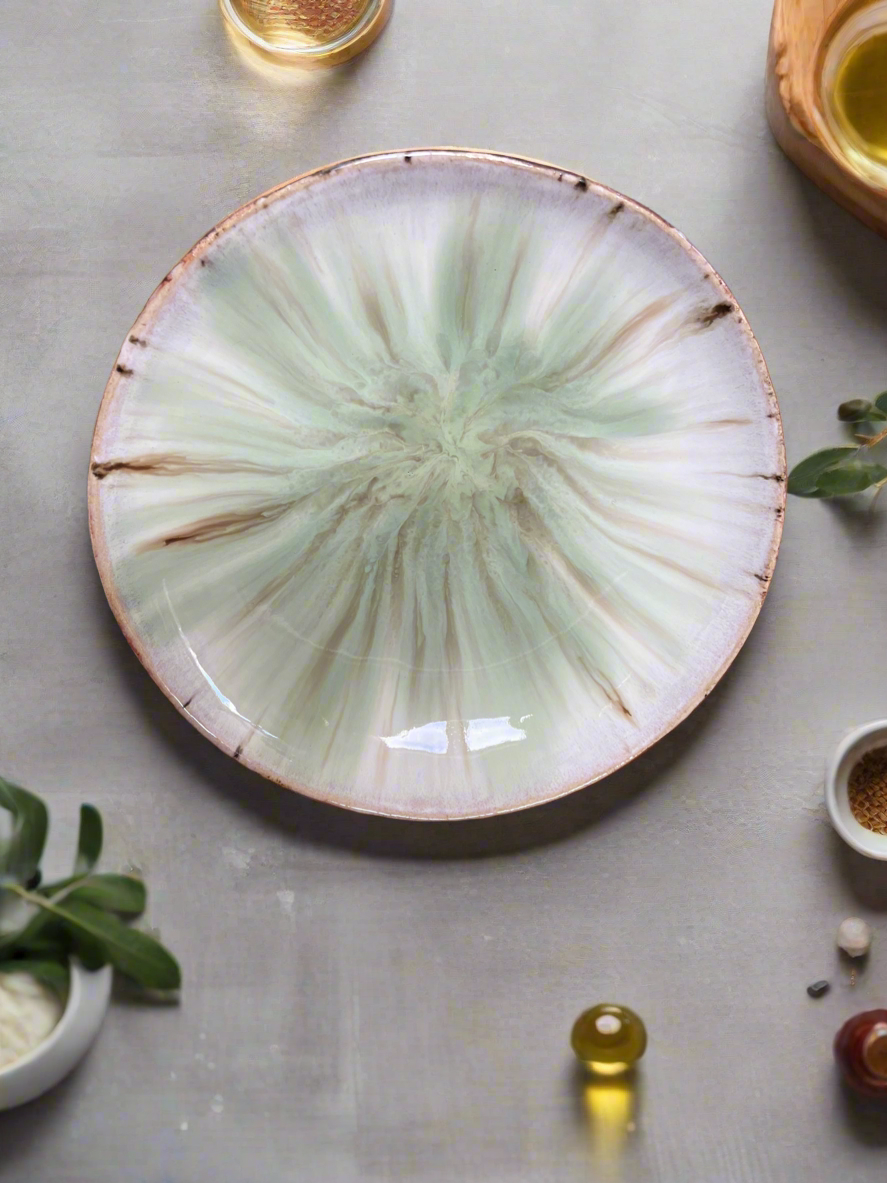 Shallow footed bowl in earthy creams and greens