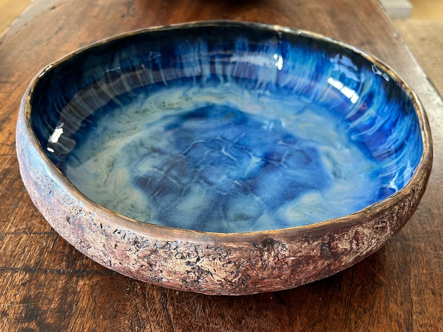 Curved rim deep bowl