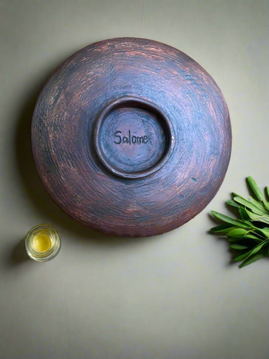 Shallow footed bowl in earthy creams and greens